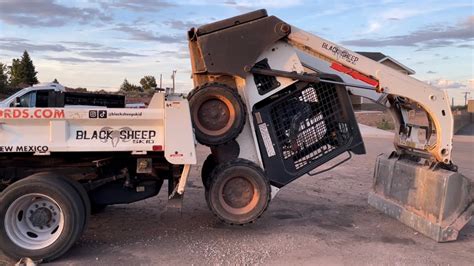 loading skid steer in dump trailer without ramp|skid steer in dump trailer.